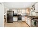 Modern kitchen, stainless steel appliances and light wood cabinets at 4189 Cannes Ave, Lake Wales, FL 33859