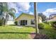 Home's backyard with patio and grassy area at 4189 Cannes Ave, Lake Wales, FL 33859