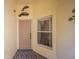 Front entry with tile flooring and decorative wall art at 4189 Cannes Ave, Lake Wales, FL 33859