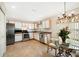 Eat-in kitchen, featuring stainless steel appliances and ample counter space at 4189 Cannes Ave, Lake Wales, FL 33859