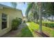 Home's backyard, showcasing a patio and trees at 4189 Cannes Ave, Lake Wales, FL 33859