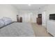 Main bedroom with king-size bed and access to additional rooms at 112 Sofia Ln, Lake Alfred, FL 33850