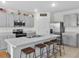 Modern kitchen with stainless steel appliances and an island with seating at 112 Sofia Ln, Lake Alfred, FL 33850