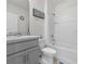 Clean bathroom with a tub and gray vanity at 112 Sofia Ln, Lake Alfred, FL 33850