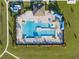 Community pool and clubhouse with surrounding green space at 112 Sofia Ln, Lake Alfred, FL 33850