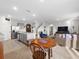 Open concept kitchen with island and stainless steel appliances at 112 Sofia Ln, Lake Alfred, FL 33850