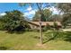 Ranch-style brick home with mature landscaping at 109 Odin Dr, Winter Haven, FL 33884