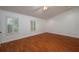 Spacious bedroom with wood flooring and plenty of natural light at 109 Odin Dr, Winter Haven, FL 33884