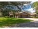 Brick home with a two-car garage and lush lawn at 109 Odin Dr, Winter Haven, FL 33884
