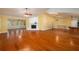 Large living room with hardwood floors and a fireplace at 109 Odin Dr, Winter Haven, FL 33884