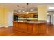 Spacious kitchen with granite countertops and wooden cabinetry at 109 Odin Dr, Winter Haven, FL 33884