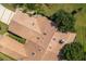 Aerial view showcasing the home's tile roof and landscaping at 109 Odin Dr, Winter Haven, FL 33884