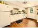 Community kitchen with white cabinets and appliances at 109 Odin Dr, Winter Haven, FL 33884