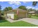 Single-story home with attached garage and manicured lawn at 466 Muirfield Ct, Winter Haven, FL 33884