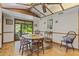 Dining room with wood table and chairs, access to backyard at 466 Muirfield Ct, Winter Haven, FL 33884