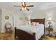 Main bedroom with hardwood floors and ceiling fan at 466 Muirfield Ct, Winter Haven, FL 33884