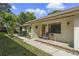 House front entrance with wood door and walkway at 466 Muirfield Ct, Winter Haven, FL 33884