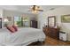 Comfortable bedroom with hardwood floors and ceiling fan at 466 Muirfield Ct, Winter Haven, FL 33884