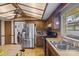 Kitchen boasts stainless steel appliances and wood cabinets at 466 Muirfield Ct, Winter Haven, FL 33884