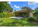 Private backyard with patio and plenty of green space at 466 Muirfield Ct, Winter Haven, FL 33884