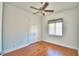 Well-lit bedroom featuring hardwood floors and ceiling fan at 192 Juliana Ridge Way, Auburndale, FL 33823