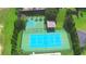 Aerial view of tennis and basketball courts at 192 Juliana Ridge Way, Auburndale, FL 33823