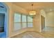 Breakfast nook boasts a bay window and stylish light fixture at 192 Juliana Ridge Way, Auburndale, FL 33823