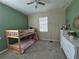 Cozy bedroom with a bunk bed and plenty of storage at 13515 Lake Yale View Loop, Grand Island, FL 32735