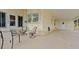 Spacious patio with seating area and access to the storage shed at 166 Rita Bee Ave, Davenport, FL 33897