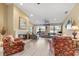 Bright living room featuring a fireplace, hardwood floors and large windows at 6001 Country Club Dr, Lake Wales, FL 33898