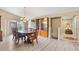 Open concept dining room with hardwood floors and chandelier at 6001 Country Club Dr, Lake Wales, FL 33898