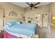 Main bedroom with king bed and en-suite bathroom access at 6001 Country Club Dr, Lake Wales, FL 33898