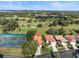 Aerial view of home near golf course and tennis court at 6001 Country Club Dr, Lake Wales, FL 33898