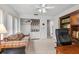 Spacious office with built-in shelving and a sofa at 6001 Country Club Dr, Lake Wales, FL 33898