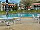 Community pool with patio furniture and a refreshing pool at 6001 Country Club Dr, Lake Wales, FL 33898