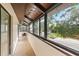 Screened-in lanai with carpeting and seating at 6001 Country Club Dr, Lake Wales, FL 33898