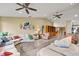 Open living area with hardwood floors, ample seating, and natural light at 6001 Country Club Dr, Lake Wales, FL 33898