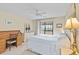 Bedroom with desk, dresser, and a comfortable bed at 6001 Country Club Dr, Lake Wales, FL 33898