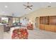 Spacious living room with vaulted ceilings, hardwood floors, and a cozy fireplace at 6001 Country Club Dr, Lake Wales, FL 33898