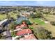 Aerial view showing home near golf course and tennis courts at 6001 Country Club Dr, Lake Wales, FL 33898