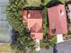Aerial view of a home with red tile roof, near tennis courts at 6001 Country Club Dr, Lake Wales, FL 33898