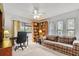 Home office with a desk, bookshelves, and sofa at 6001 Country Club Dr, Lake Wales, FL 33898
