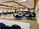 Large community room with stage and tables at 627 Watercrest Dr, Haines City, FL 33844