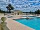 Community pool and spa with plenty of lounge chairs at 627 Watercrest Dr, Haines City, FL 33844