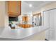 Modern kitchen with stainless steel appliances and light wood cabinets at 627 Watercrest Dr, Haines City, FL 33844