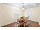 Dining room with hardwood floors and a modern chandelier at 627 Watercrest Dr, Haines City, FL 33844