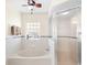 Bathroom with a large garden tub and walk-in shower at 627 Watercrest Dr, Haines City, FL 33844