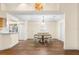 Charming dining room featuring a wood table and white chairs at 627 Watercrest Dr, Haines City, FL 33844