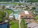 Aerial view of community with pool and tennis courts at 627 Watercrest Dr, Haines City, FL 33844