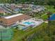Aerial view of community amenities including pool and tennis courts at 627 Watercrest Dr, Haines City, FL 33844